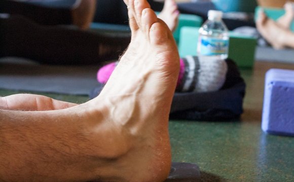 Photo: a foot on a yoga mat