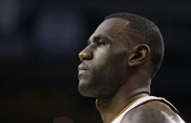 Cleveland Cavaliers' LeBron James waits for action to resume in the first half of an NBA basketball game against the Phoenix Suns, Wednesday, Jan. 27, 2016, in Cleveland. (AP Photo/Tony Dejak)