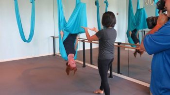 CNBC's Diana Olick doing aerial yoga.