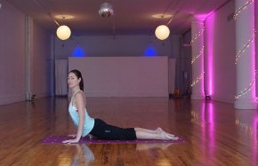 Tara in her NYC studio in a low lunge posture