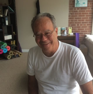 Tony Enright teaches yoga at Mindful Yoga Center in Newington, CT